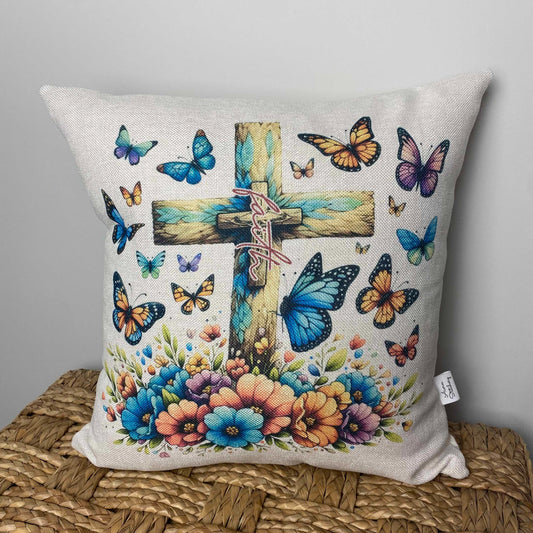 faith on a cross with butterflies on a pillow