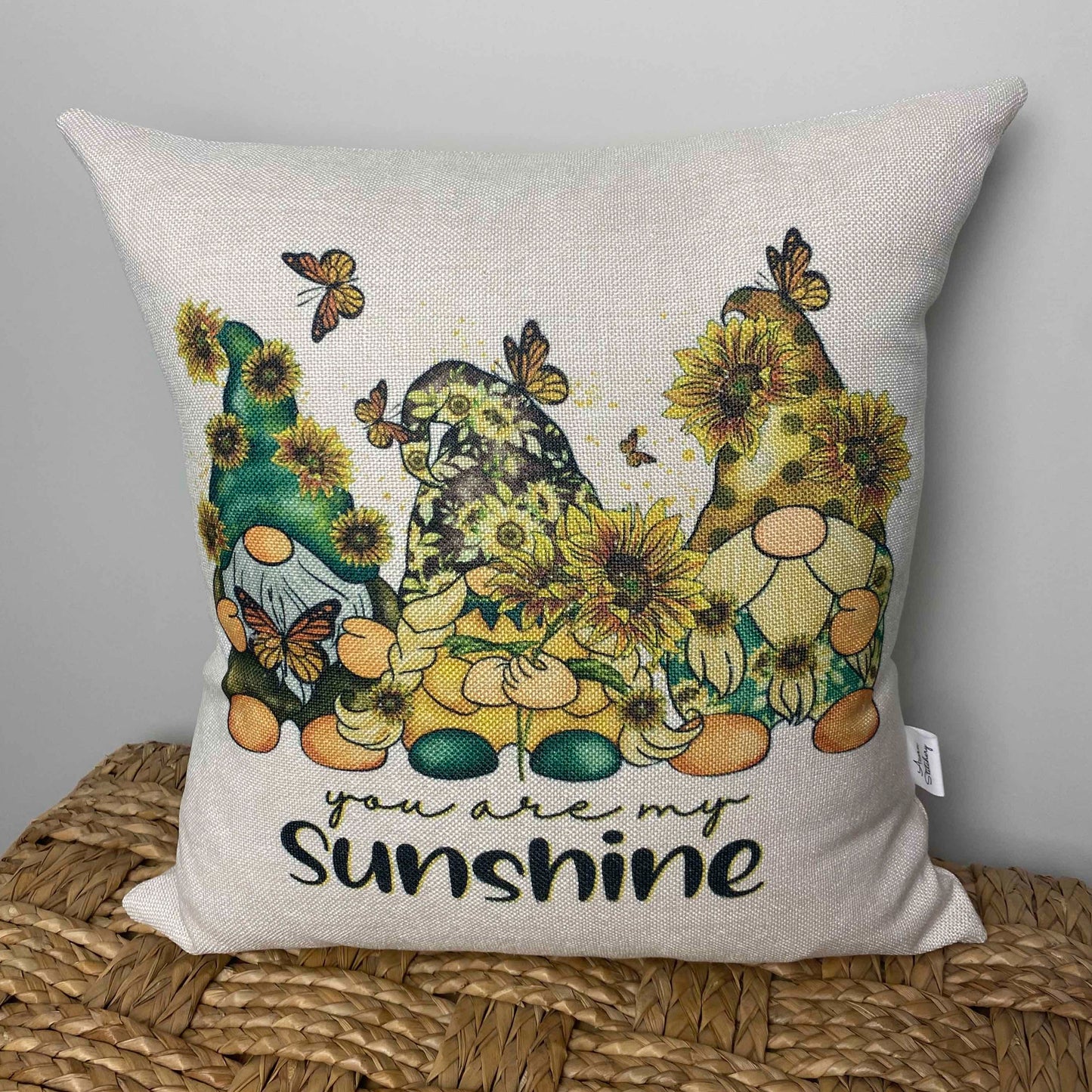 gnomes with sunflowers and the words you are my sunshine on a pillow